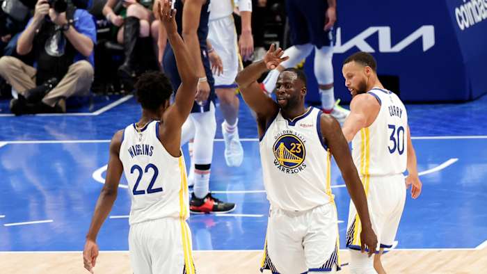 Golden State Warriors forward Andrew Wiggins (22) and Golden State Warriors forward Draymond Green (23) and Golden State Warriors guard Stephen Curry.